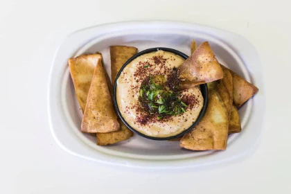 Plate with hummus and pita chips