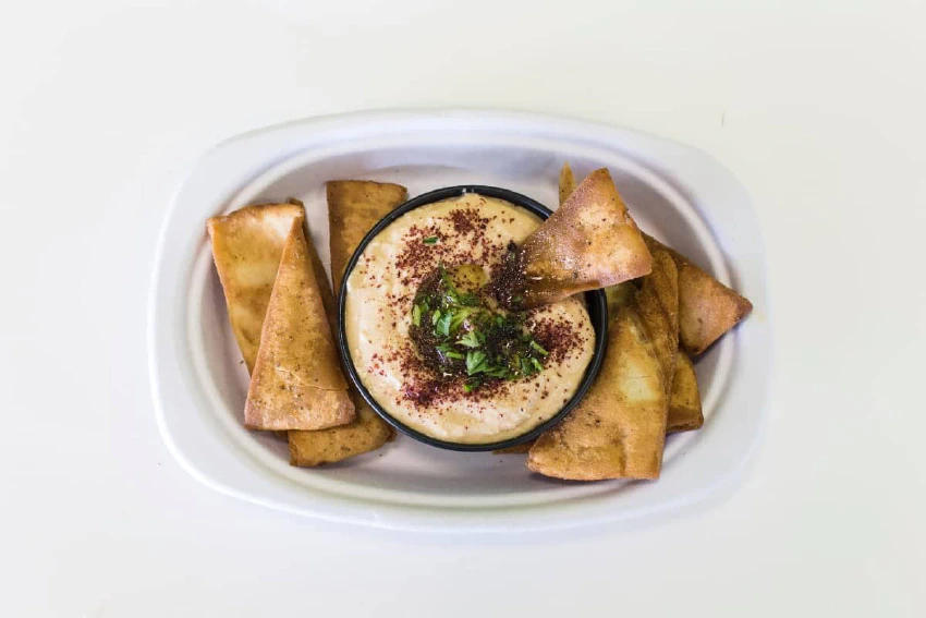 Plate with hummus and pita chips