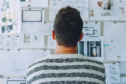 Looking at sketches on a wall