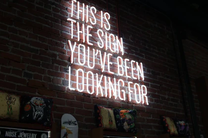 Neon sign saying 'This is the sign you have been waiting for'