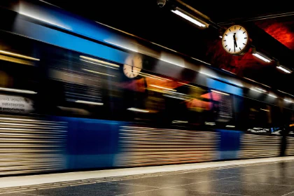 Subway train rushing through a station in Stockholm