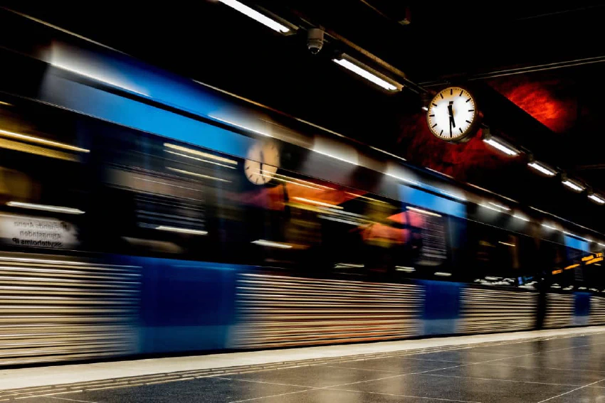 Subway train rushing through a station in Stockholm